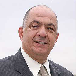 GUS MARKOU, President and Chief Operating Officer